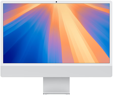 A sleek desktop computer with a vibrant sunset-colored gradient wallpaper on its screen, featuring shades of blue, orange, and yellow. The computer has a thin, white bezel and stands on a minimalist white base.